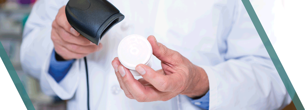 Pharmacist scanning bottle of pills